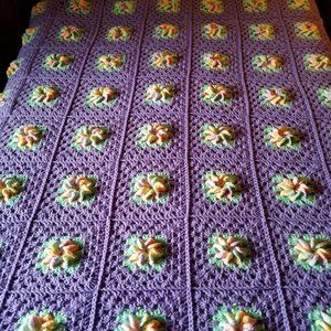 Purple Granny Square Afghan with flower centers